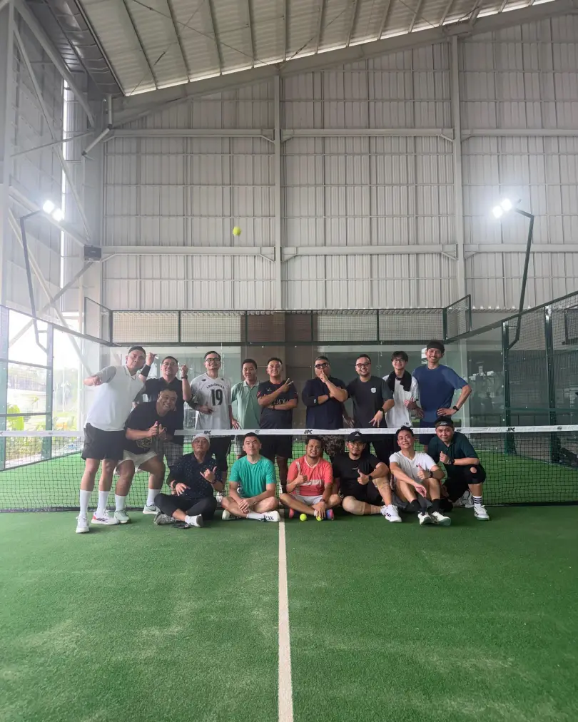 A group posing on court